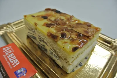 Sponge cake with cream and nuts.