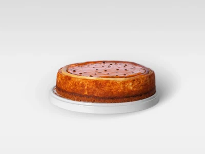 Cheese Cake con con coulis de maracuyá.